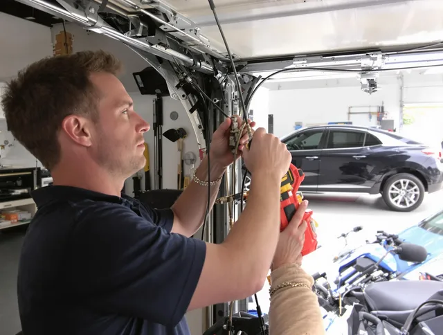 Davie Garage Door Repair safety certified technician performing cable replacement in Davie