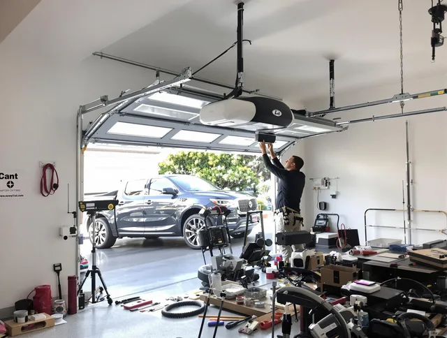 Davie Garage Door Repair specialist installing smart garage door opener system in Davie home