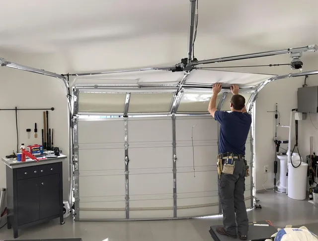 Davie Garage Door Repair specialist performing precise section replacement on Davie garage door